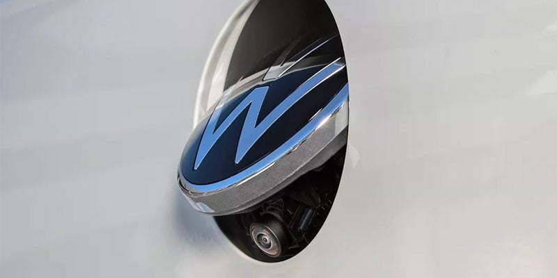 Close-up of Volkswagen emblem on a vehicle.