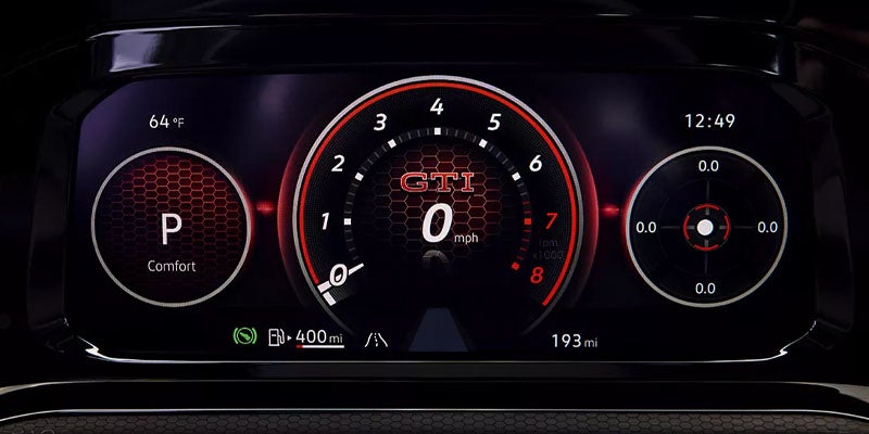 Volkswagen GTI digital instrument cluster showing speedometer and driving data.