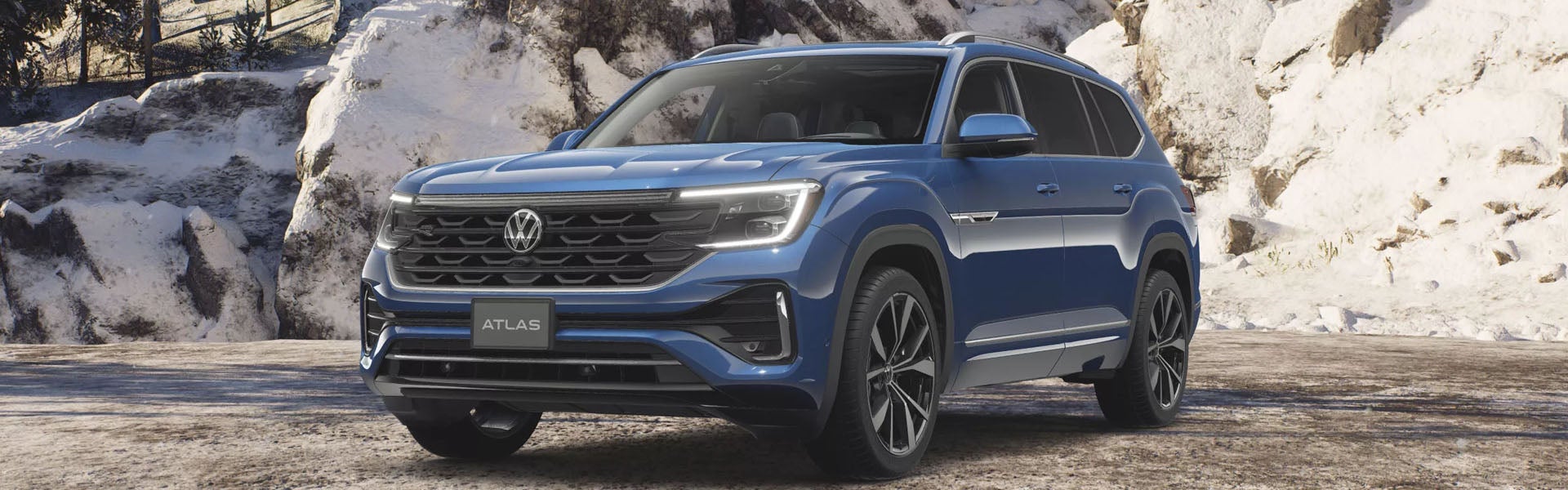 Blue 2026 Volkswagen Atlas front three-quarter view with bold grille and LED headlights.