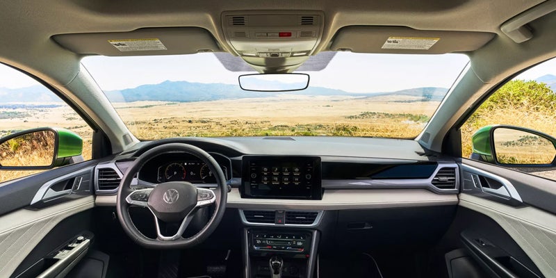 Volkswagen Taos interior dashboard and steering wheel view.