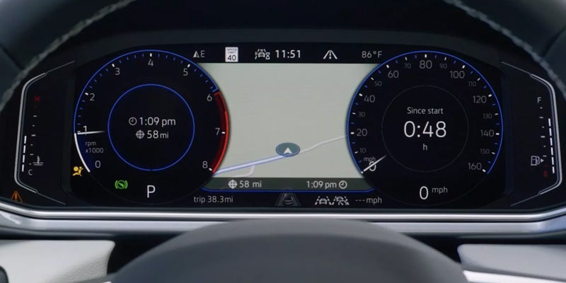 Volkswagen digital instrument cluster showing speedometer and driving information.